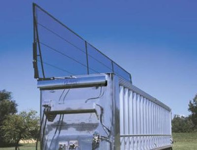 Aero Lid 2 transfer trailer tarp system in operation with tarp half way open.