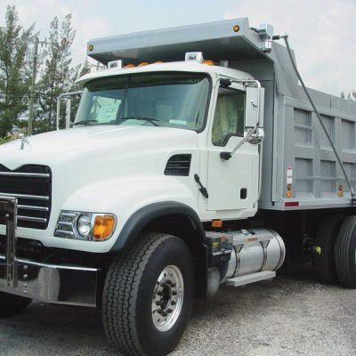 Donovan Hammer System with steel swing arms installed on tandem axle dump truck